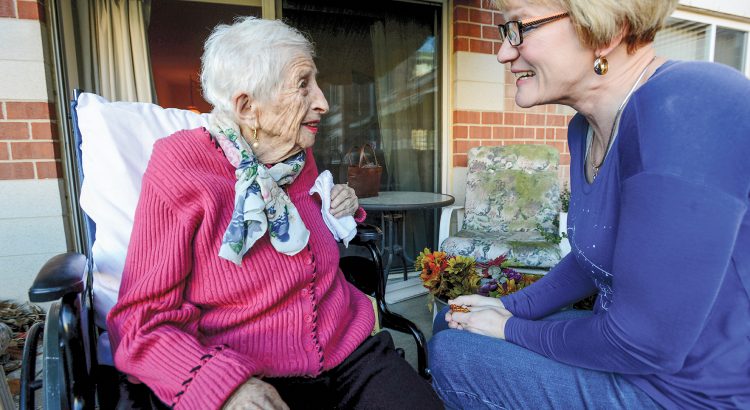 Hospice nurse with patient at home