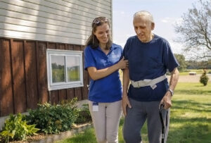 ascension at home nurse walks with patient outdoors