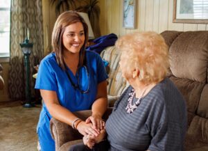 nurse smiles while talking with patient about advanced care management