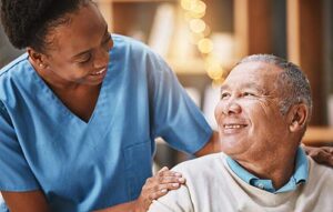 patient smiles at nurse while discussing end of life care for als