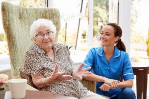 nurse and patient discuss hospice for end-stage multiple sclerosis