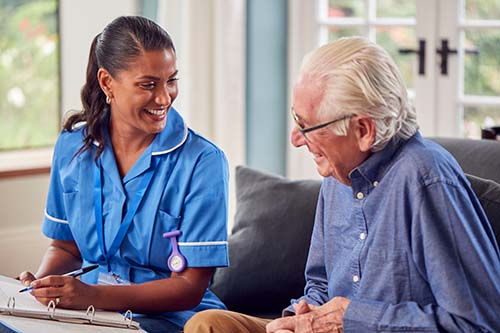 nurse and patient discuss managing shortness of breath near the end of life