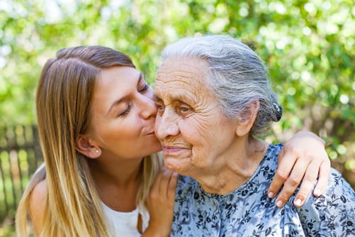 patient receives kiss on the cheek from loved one while they discuss adult failure to thrive