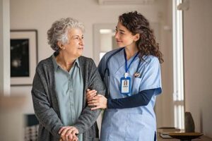 nurse and patient discuss hospice resources for medical directors