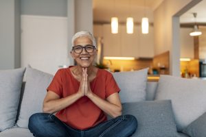 Older adult woman meditating