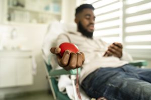 African-American man donating blood for charity