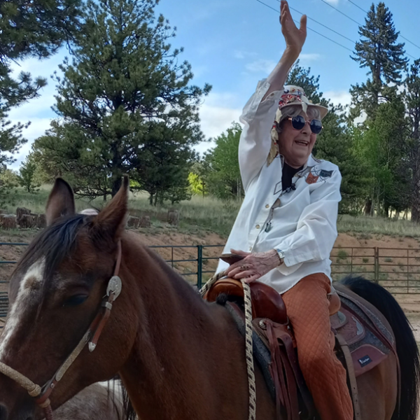 patient Imogene "Genie" Schiegg horseback riding for her 91st Birthday
